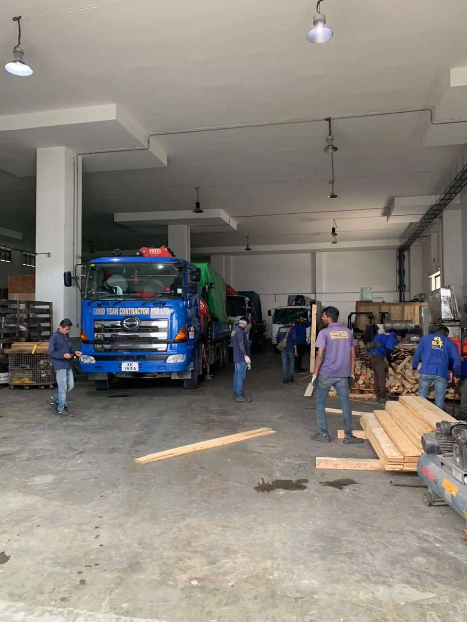 Good Year Contractor team working in warehouse